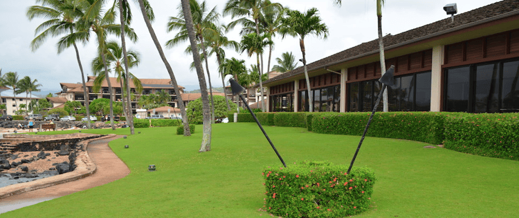 lush, green grass and neat landscape beds requires diligent landscape maintenance on Kauai