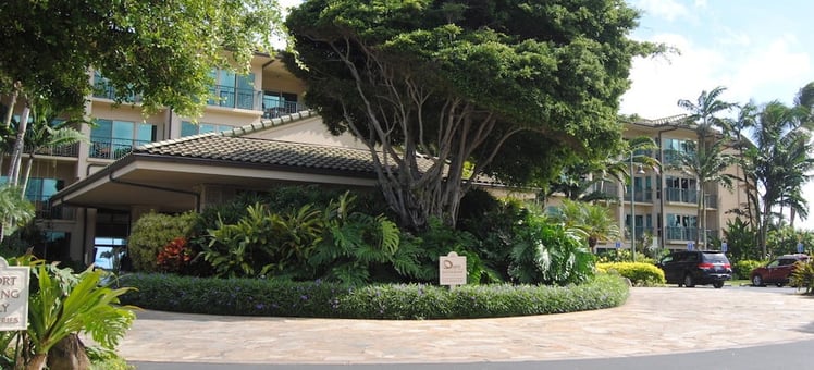 Waipouli Beach Resort's entryway is encased in a lush, tropical landscape.